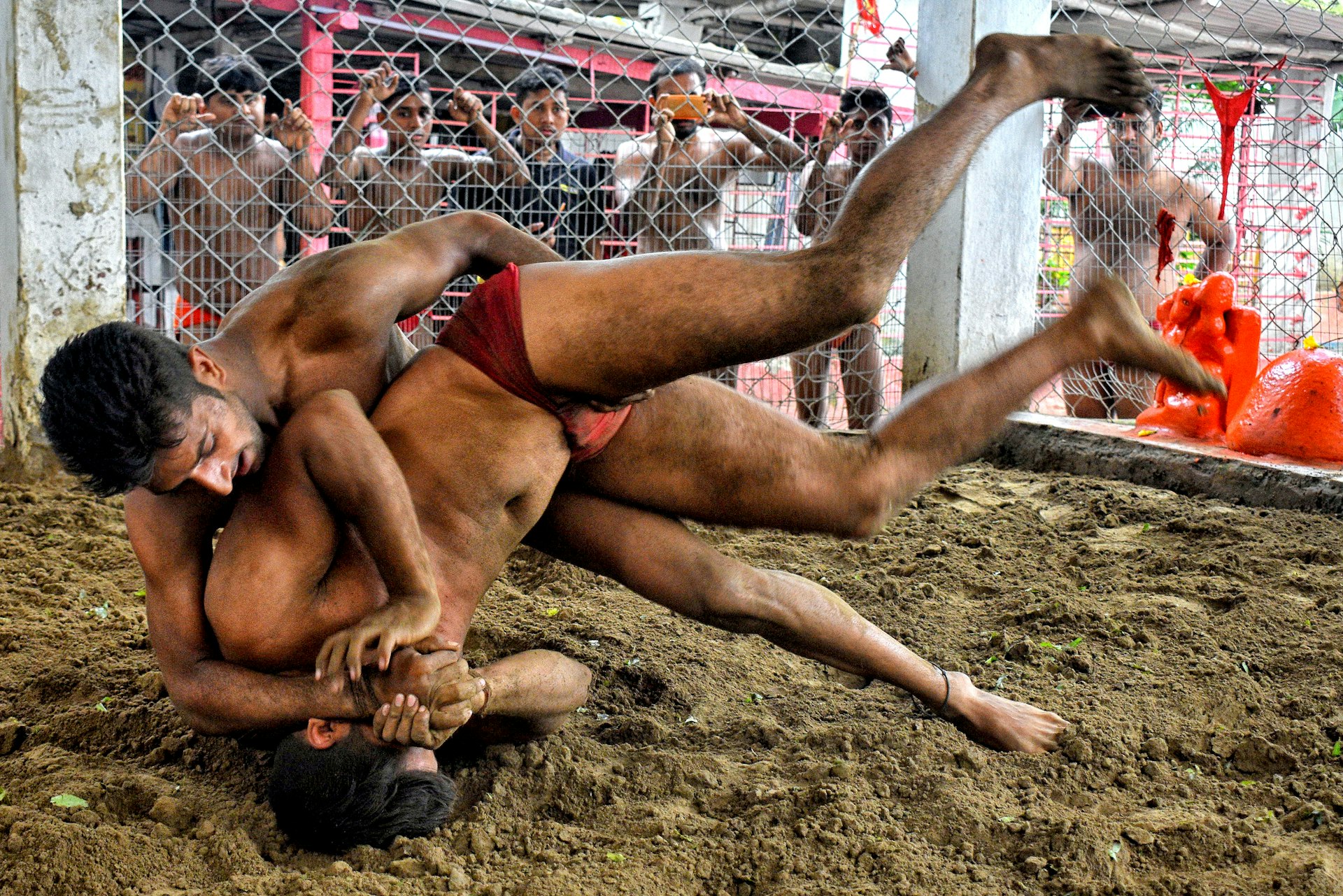 a couple of men wrestling